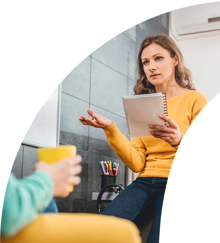 Picture of a lady working at the Bridgehead offices, holding a notepad