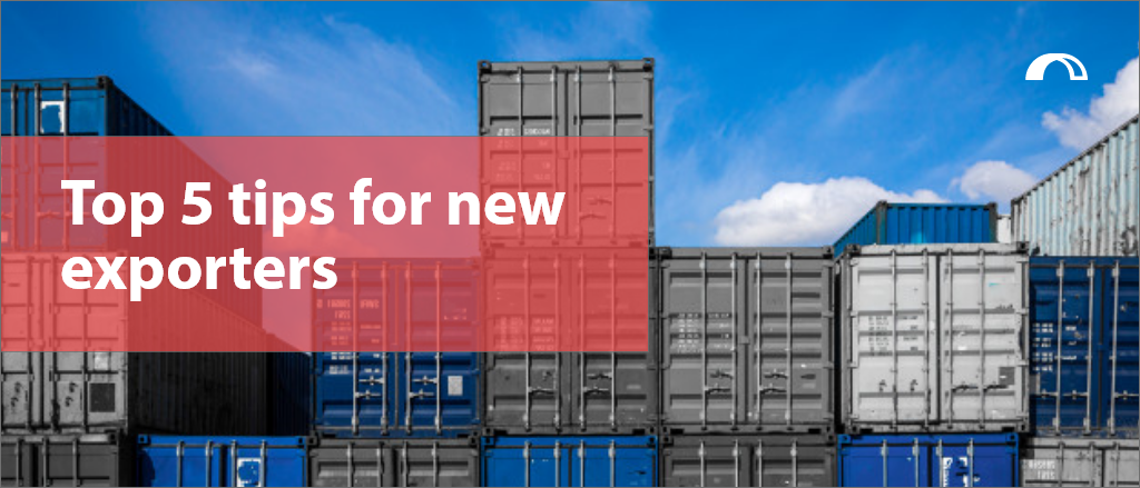 This blog looks at how SMEs start exporting, reasons to export as well as our tips for new exporters to guarantee your international success - photo of shipping containers stacked at a port